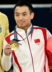 Zou Jingyuan at the parallel bars medal ceremony, Paris 2024
